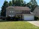 Charming two-story home with a well-maintained lawn, inviting entrance, and attached two-car garage at 9624 Langston Mill Rd, Charlotte, NC 28216