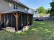 A covered gazebo looks out to a big backyard and lounge area at 9624 Langston Mill Rd, Charlotte, NC 28216