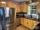 Charming kitchen featuring wood cabinets, stainless steel appliances, and granite countertops at 9624 Langston Mill Rd, Charlotte, NC 28216