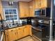 Modern kitchen with stainless steel appliances and ample cabinetry at 9624 Langston Mill Rd, Charlotte, NC 28216