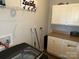 Bright laundry room with modern washer and dryer, and cabinets at 9624 Langston Mill Rd, Charlotte, NC 28216