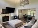 Inviting living room with vaulted ceilings, fireplace, plush furniture, and a view into the recreation room at 9624 Langston Mill Rd, Charlotte, NC 28216
