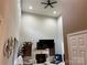 High-ceiling living room with a fireplace and large TV; view from the entryway at 9624 Langston Mill Rd, Charlotte, NC 28216