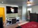 Stylish main bedroom boasting a large television, neutral walls, and ample closet space at 9624 Langston Mill Rd, Charlotte, NC 28216