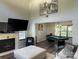 The recreation room features hardwood floors, a modern light fixture, and a pool table at 9624 Langston Mill Rd, Charlotte, NC 28216