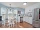 Modern kitchen with white cabinets, stainless steel appliances, and breakfast nook at 101 Ingonish Dr, Gastonia, NC 28056