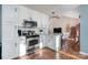 Bright kitchen with stainless steel appliances and view into living room at 101 Ingonish Dr, Gastonia, NC 28056