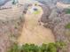 Aerial view showing farmhouse, detached garage, and expansive property at 1026 Walker Branch Rd, Lincolnton, NC 28092