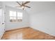 Spacious bedroom with hardwood floors and ceiling fan at 1026 Walker Branch Rd, Lincolnton, NC 28092