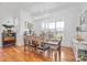 Spacious dining room with hardwood floors, large windows, and a beautiful chandelier at 1026 Walker Branch Rd, Lincolnton, NC 28092