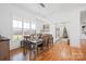 Spacious dining room with hardwood floors, large windows, and a beautiful chandelier at 1026 Walker Branch Rd, Lincolnton, NC 28092