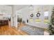 Bright and spacious entryway with hardwood floors, a view of the backyard, and a large chandelier at 1026 Walker Branch Rd, Lincolnton, NC 28092