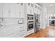 Modern kitchen features white cabinets, stainless steel appliances, and hexagon tile at 1026 Walker Branch Rd, Lincolnton, NC 28092