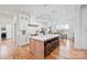 Modern kitchen with white cabinets, breakfast bar and hardwood floors at 1026 Walker Branch Rd, Lincolnton, NC 28092