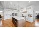 Open concept kitchen with white cabinets and hardwood floors at 1026 Walker Branch Rd, Lincolnton, NC 28092