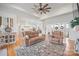 Open living room with hardwood floors, fireplace, built-ins, and access to the backyard at 1026 Walker Branch Rd, Lincolnton, NC 28092