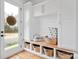 Mudroom with built-in bench, storage, and white shaker cabinets at 1026 Walker Branch Rd, Lincolnton, NC 28092