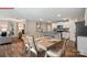 Open-concept dining area adjacent to a modern kitchen with a view of the outdoor space at 1058 Horizon Ave, Chester, SC 29706