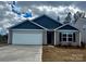 Charming single-story home features a two-car garage and well-manicured lawn at 1058 Horizon Ave, Chester, SC 29706