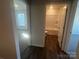 Hallway view showing bedroom with carpet and bathroom with hard surface floors at 1058 Horizon Ave, Chester, SC 29706