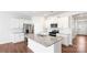 Modern kitchen with white cabinets, granite island and stainless steel appliances at 1058 Horizon Ave, Chester, SC 29706