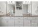 Modern bathroom with double sinks, granite countertops, and a built-in storage at 1248 Thomas Knapp Pkwy, Fort Mill, SC 29715