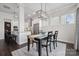 Elegant dining room with farmhouse table and chandelier at 1248 Thomas Knapp Pkwy, Fort Mill, SC 29715