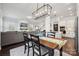 Open concept dining area with view to living room and kitchen at 1248 Thomas Knapp Pkwy, Fort Mill, SC 29715