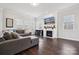 Living room with gray sectional sofa, fireplace, and hardwood floors at 1248 Thomas Knapp Pkwy, Fort Mill, SC 29715