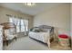 Bedroom with daybed, wicker chair, and window with curtains at 1257 Stacey Ln, Indian Land, SC 29707