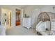 Bedroom with dresser, wicker chair, and view into bathroom at 1257 Stacey Ln, Indian Land, SC 29707