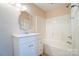 Clean bathroom with white vanity, tub and tile floor at 13441 Calloway Glen Dr, Charlotte, NC 28273