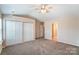 Spacious bedroom with ceiling fan and large closet at 13441 Calloway Glen Dr, Charlotte, NC 28273