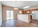 Dining area with hardwood floors and sliding glass door to patio at 13441 Calloway Glen Dr, Charlotte, NC 28273