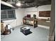 Unfinished basement workshop with workbench and storage at 1364 5Th Street Nw Cir, Hickory, NC 28601