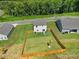 Aerial view of house and surrounding homes at 179 Tanner Loop, Troutman, NC 28166