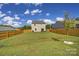 Large backyard with grassy lawn and wooden fence at 179 Tanner Loop, Troutman, NC 28166