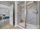 Walk-in shower with gray tile and glass enclosure at 179 Tanner Loop, Troutman, NC 28166