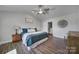 Spacious bedroom with wood flooring and ceiling fan at 179 Tanner Loop, Troutman, NC 28166