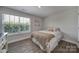 Bright bedroom with a queen-size bed and large window at 179 Tanner Loop, Troutman, NC 28166