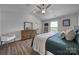 Main bedroom with wood floors, dresser, and ceiling fan at 179 Tanner Loop, Troutman, NC 28166