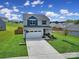 Two-story house with attached garage and basketball goal at 179 Tanner Loop, Troutman, NC 28166