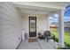 Inviting front porch with a sitting area at 179 Tanner Loop, Troutman, NC 28166