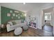 Light-filled living area with sofa and built-in shelves at 179 Tanner Loop, Troutman, NC 28166