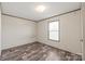 Bedroom with a window and wood-look flooring at 1805 Drew Dr, Lincolnton, NC 28092