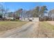 Inviting one-story home with gray siding, black shutters, and large grassy front yard at 1805 Drew Dr, Lincolnton, NC 28092