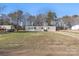 Single-story home with gray siding, black shutters and large grassy front yard at 1805 Drew Dr, Lincolnton, NC 28092