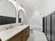 Stylish bathroom featuring double vanity and a bathtub at 210 S Millon St, Gastonia, NC 28052