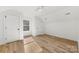 Attic bedroom featuring wood-look floors, a dormer window, and white trim at 210 S Millon St, Gastonia, NC 28052