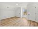 Bright attic bedroom with wood-look floors, white walls, and plenty of space at 210 S Millon St, Gastonia, NC 28052